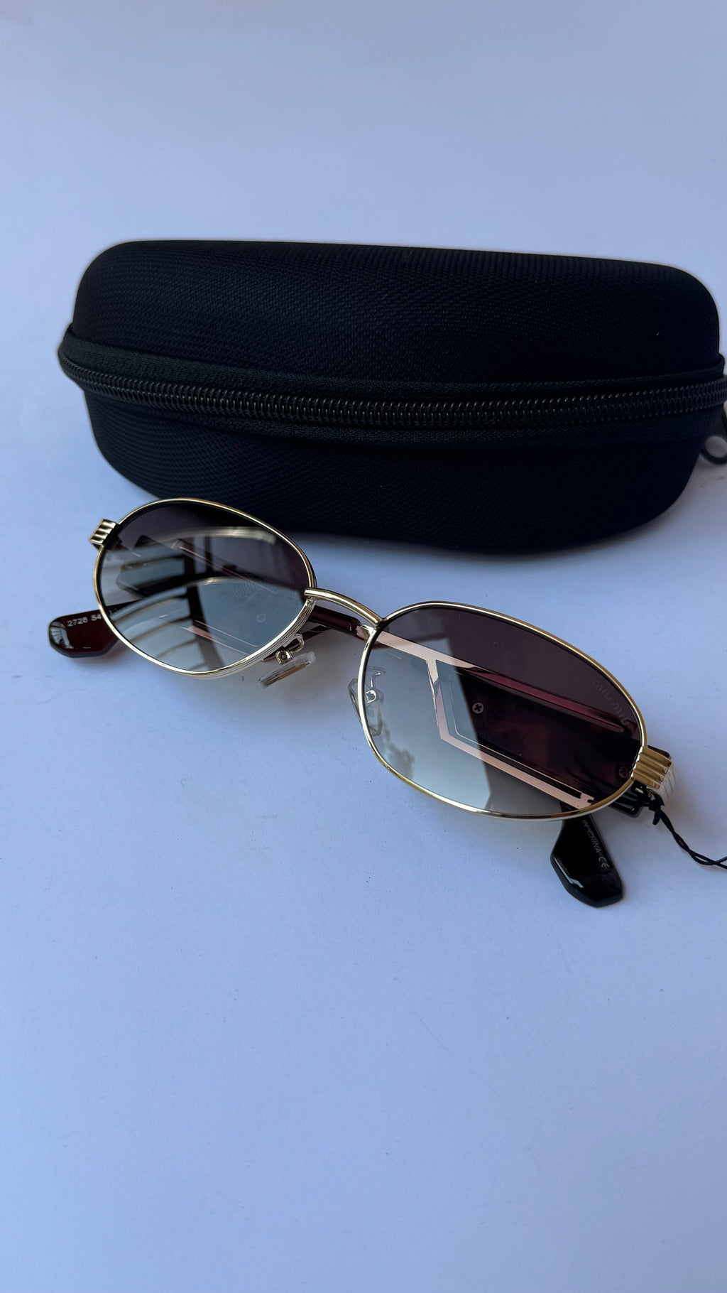 MiuMiu Oval Sunglasses