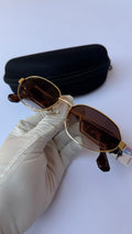 MiuMiu Oval Sunglasses