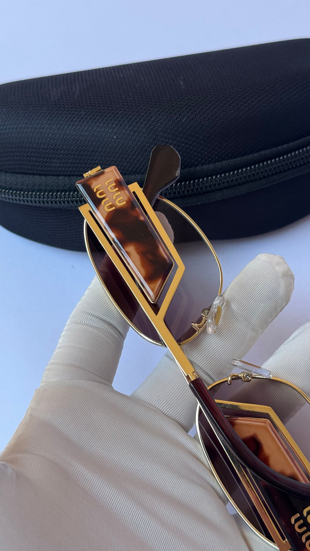 MiuMiu Oval Sunglasses